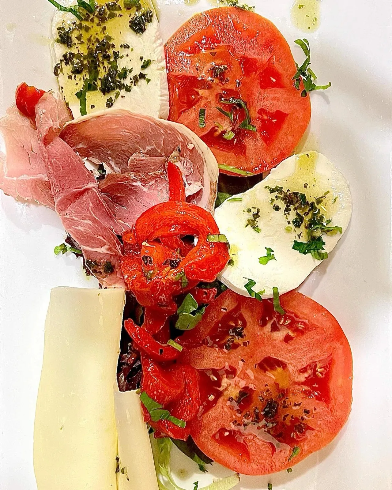 Sammy's Antipasto: prosciutto, fresh mozzarella, provolone, roasted peppers and tomatoes
